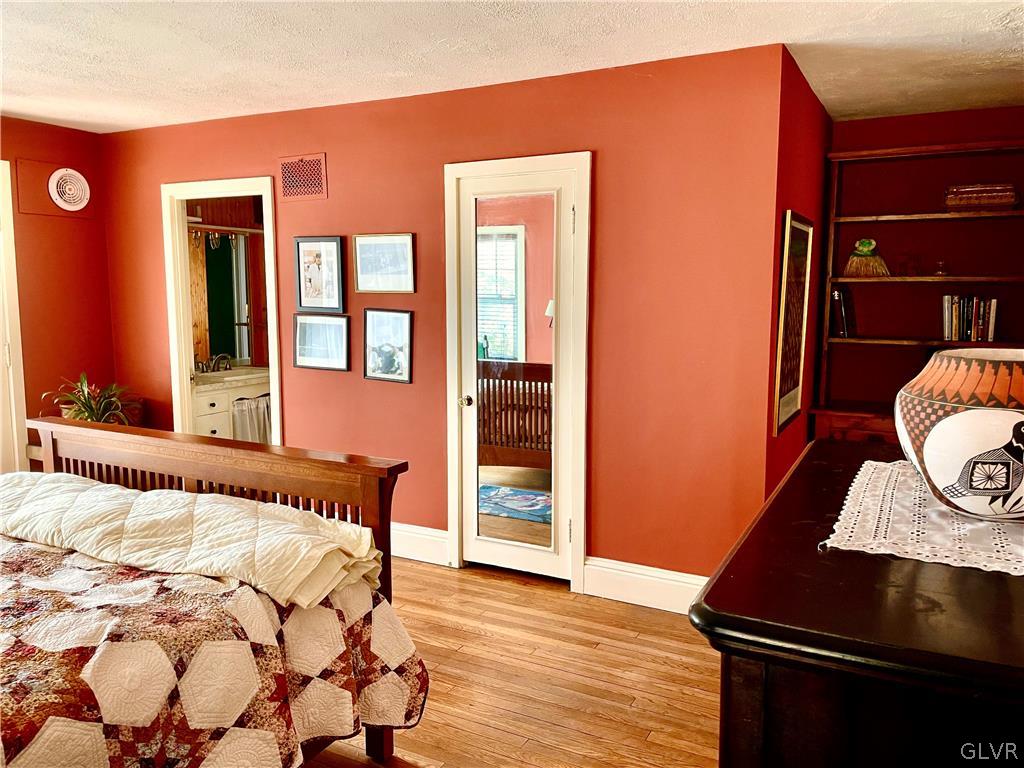 2030 Park Road Easton, PA 18045 - Photo 17 of 40 a bedroom with a bed and wooden floor