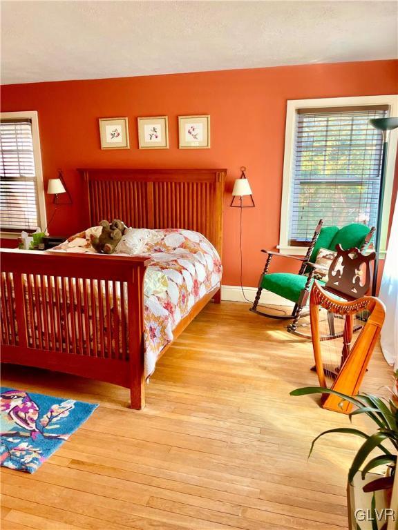 2030 Park Road Easton, PA 18045 - Photo 18 of 40 a bedroom with a bed and wooden floor