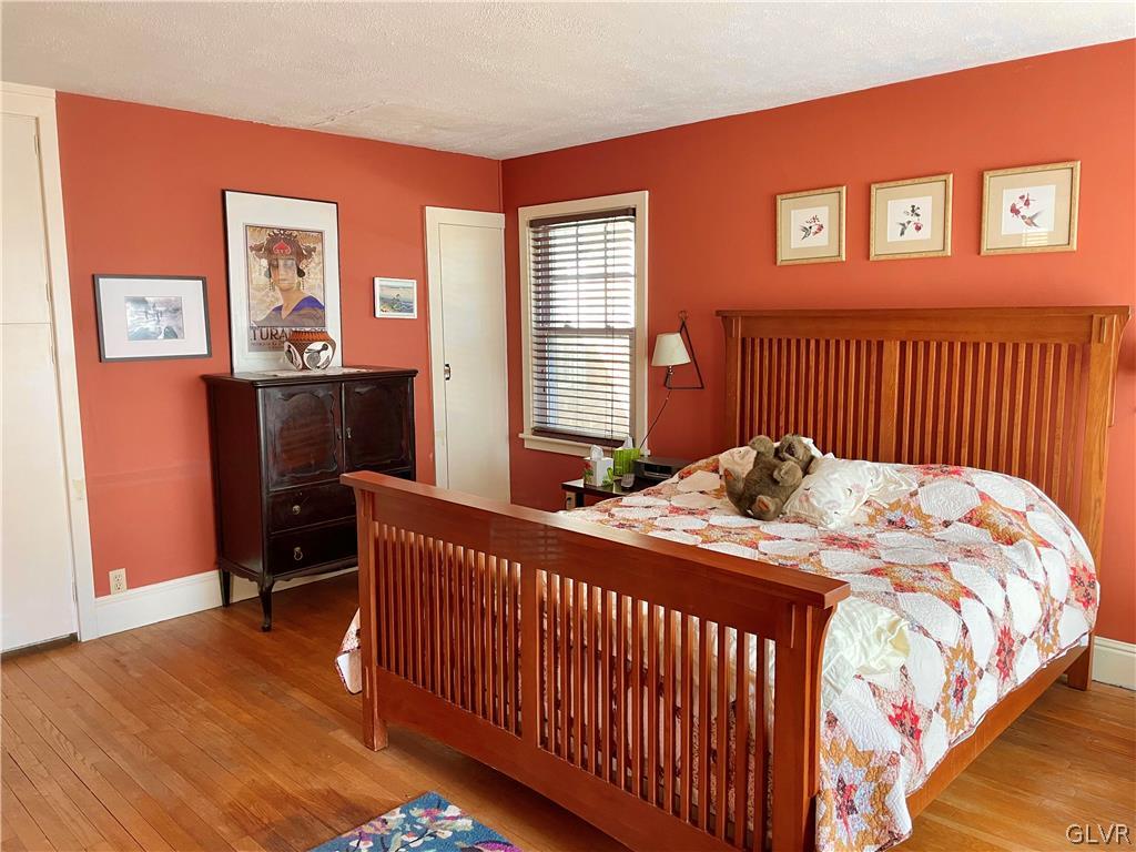 2030 Park Road Easton, PA 18045 - Photo 19 of 40 a bedroom with a bed and wooden floor