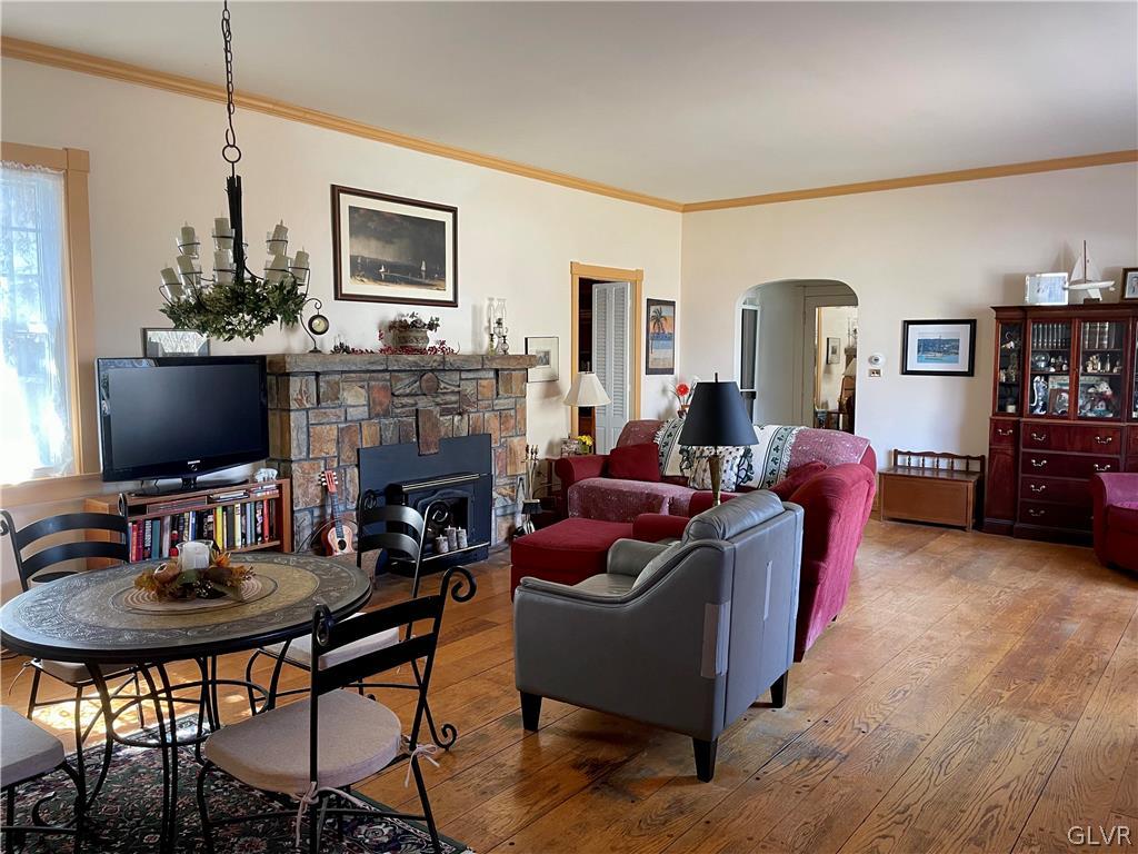 2030 Park Road Easton, PA 18045 - Photo 4 of 40 a living room with furniture a flat screen tv and a fireplace