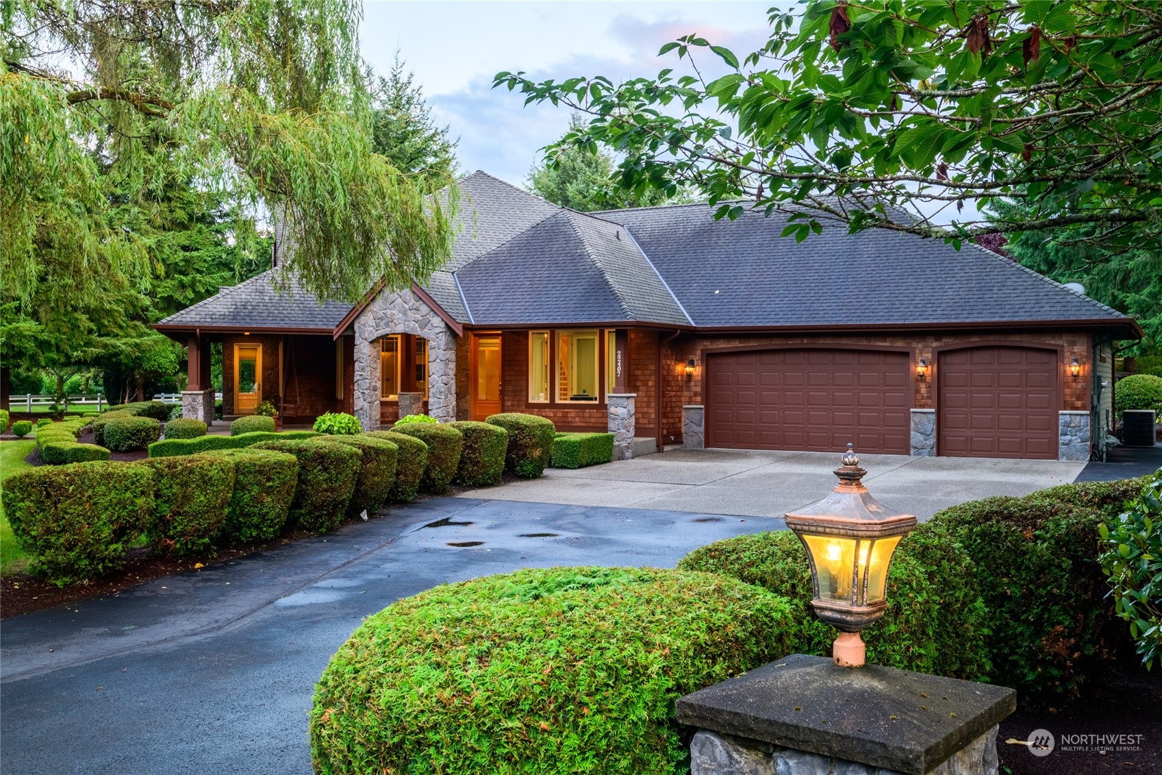 a front view of a house with garden