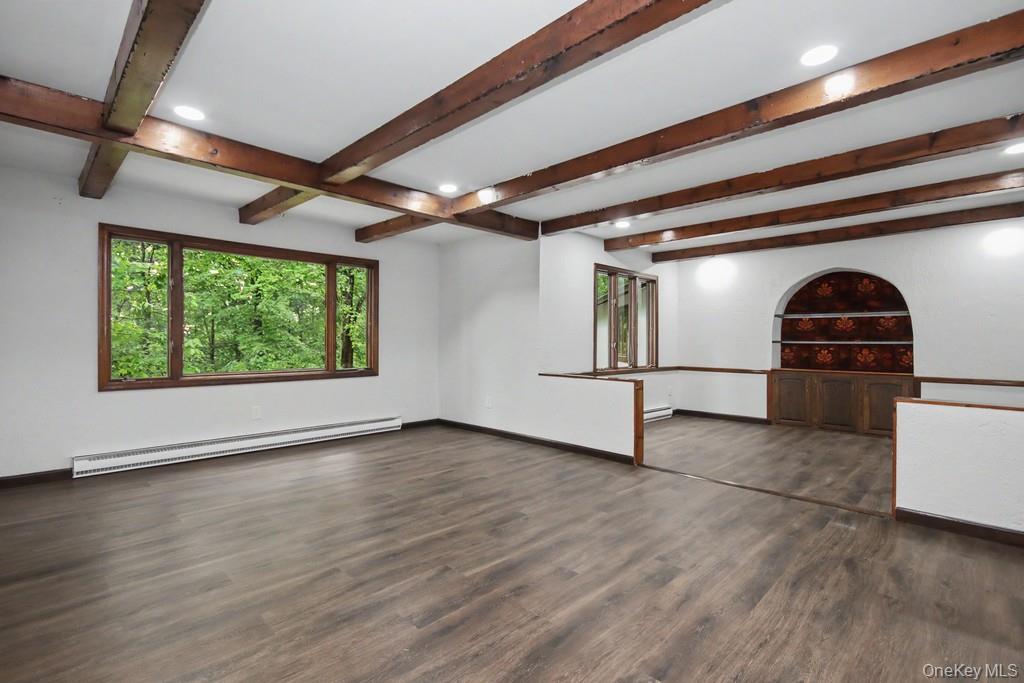 18 Hillside View Road Mahopac, NY 10541 - Photo 11 of 42 a view of empty room with wooden floor and fan