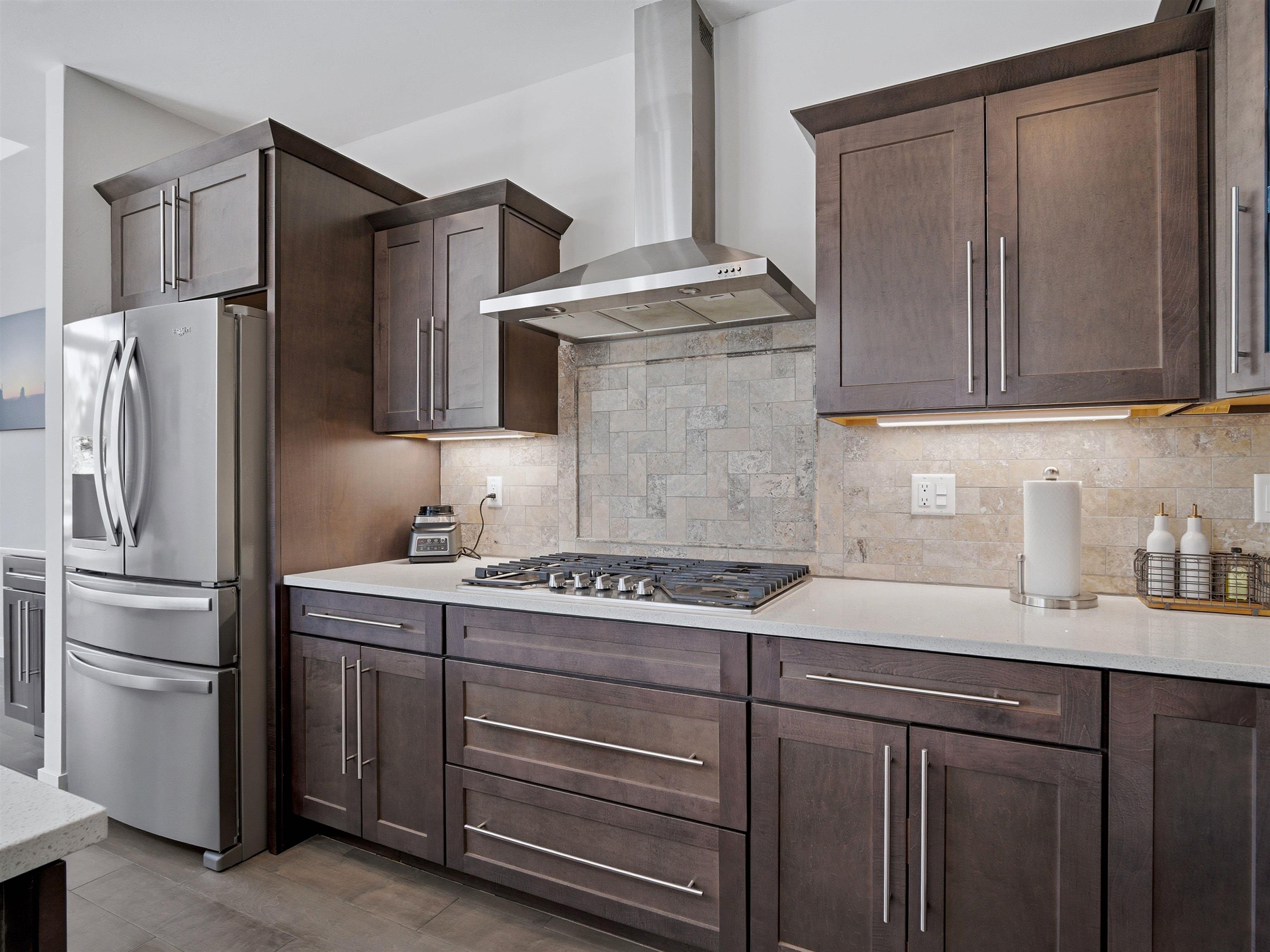 380 West Ridges Boulevard, Unit A Grand Junction, CO 81507 - Photo 11 of 41 a kitchen with a sink and a refrigerator