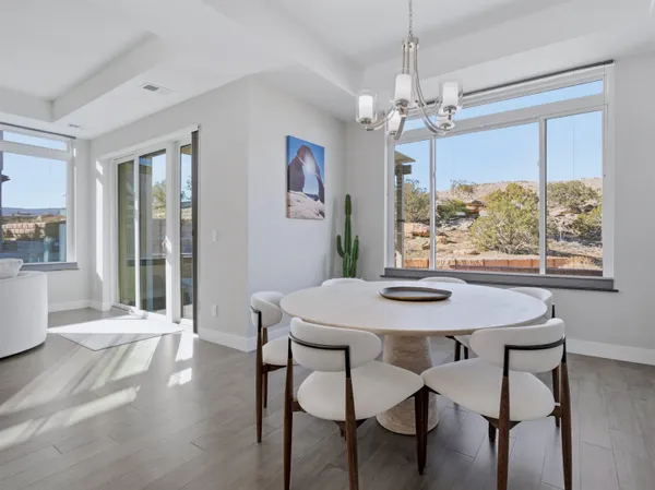 a view of a dining room with furniture window and wooden floor