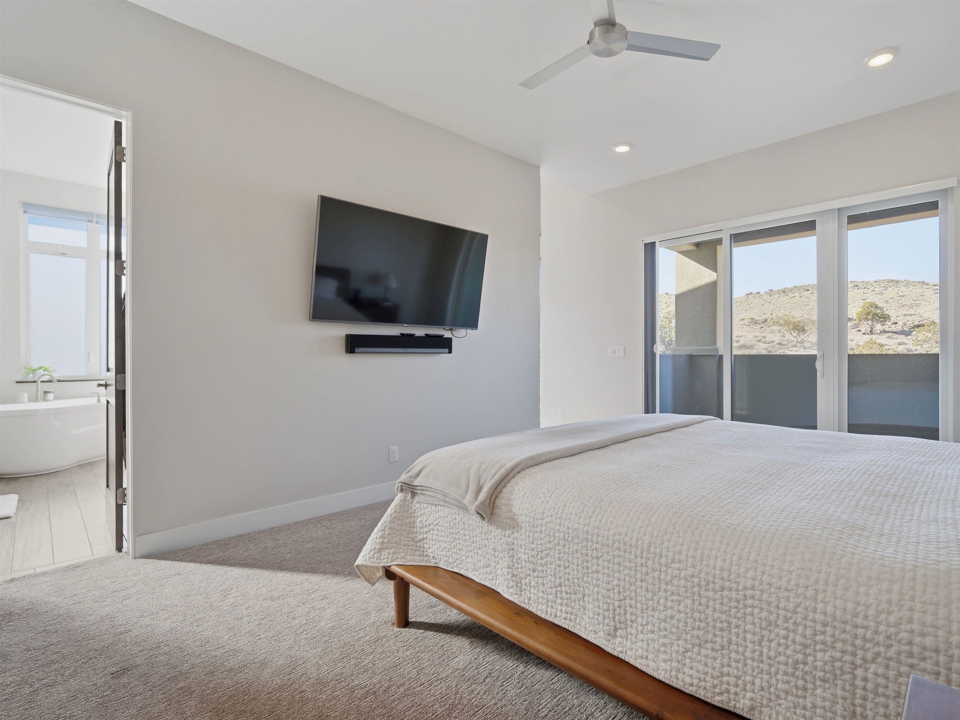 380 West Ridges Boulevard, Unit A Grand Junction, CO 81507 - Photo 16 of 41 a bedroom with a bed and a flat screen tv