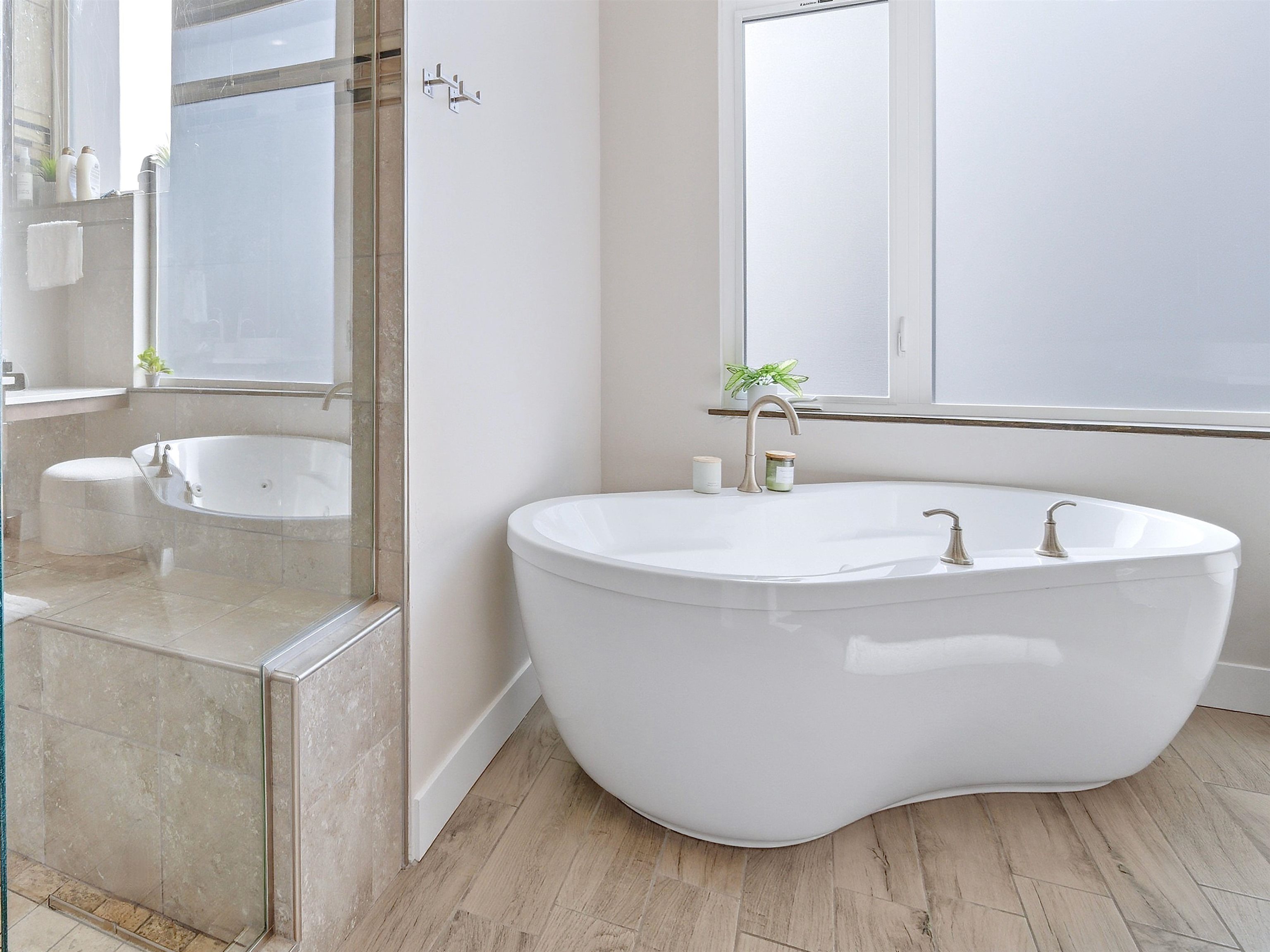 380 West Ridges Boulevard, Unit A Grand Junction, CO 81507 - Photo 19 of 41 a white bath tub sitting in a bathroom