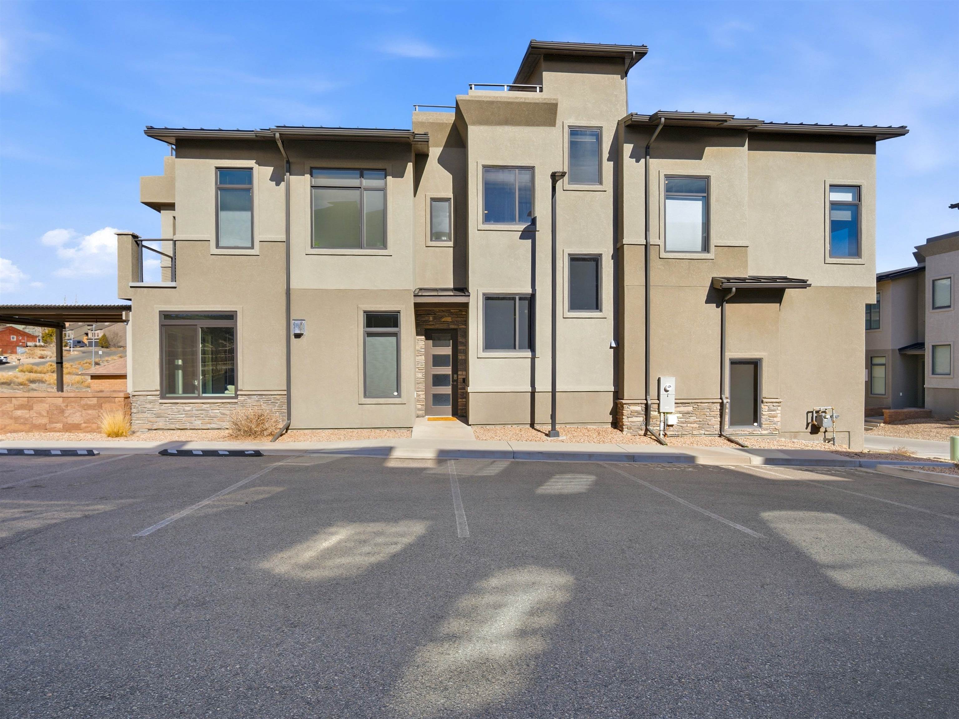 380 West Ridges Boulevard, Unit A Grand Junction, CO 81507 - Photo 2 of 41 front view of a house with a street