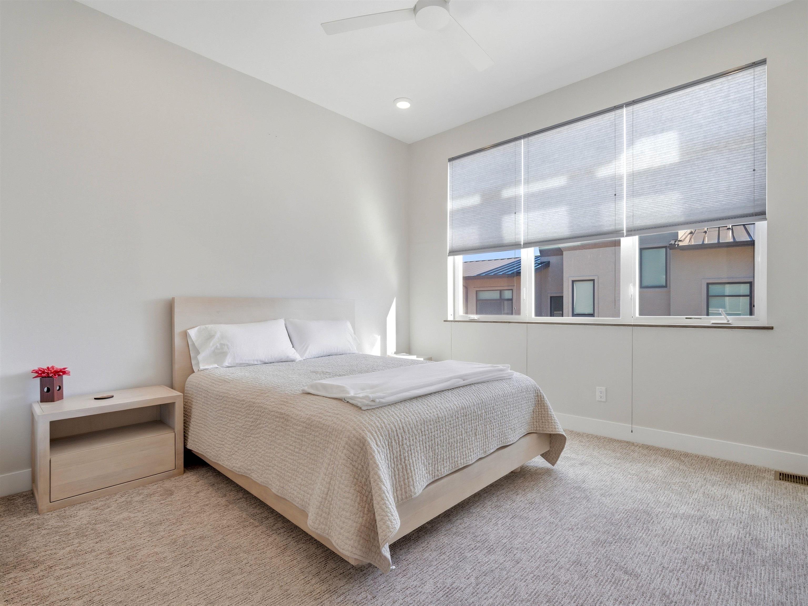 380 West Ridges Boulevard, Unit A Grand Junction, CO 81507 - Photo 24 of 41 a bedroom with a bed and a window