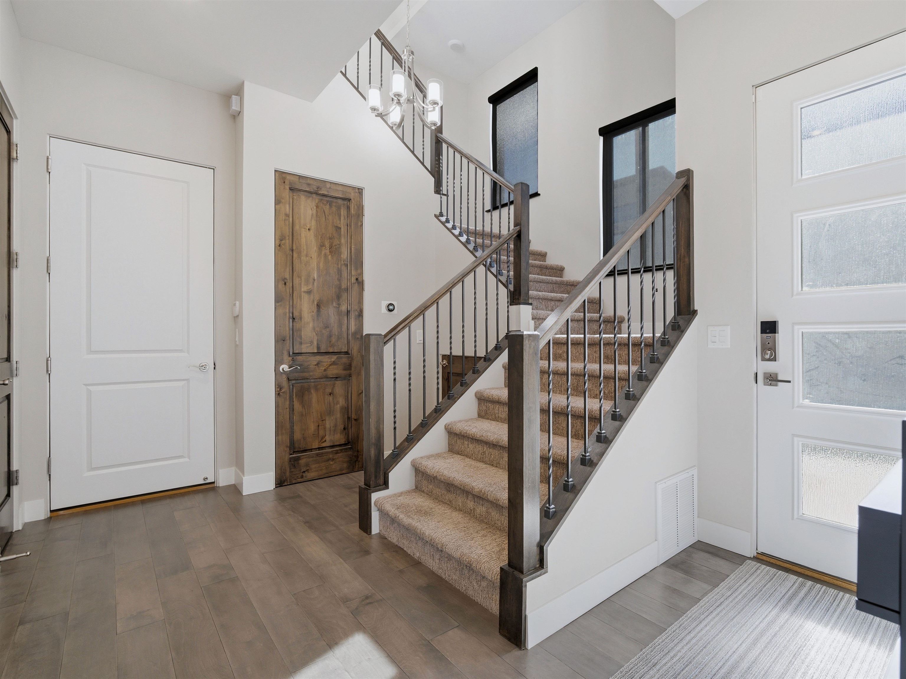 380 West Ridges Boulevard, Unit A Grand Junction, CO 81507 - Photo 3 of 41 a view of staircase with white walls and railing