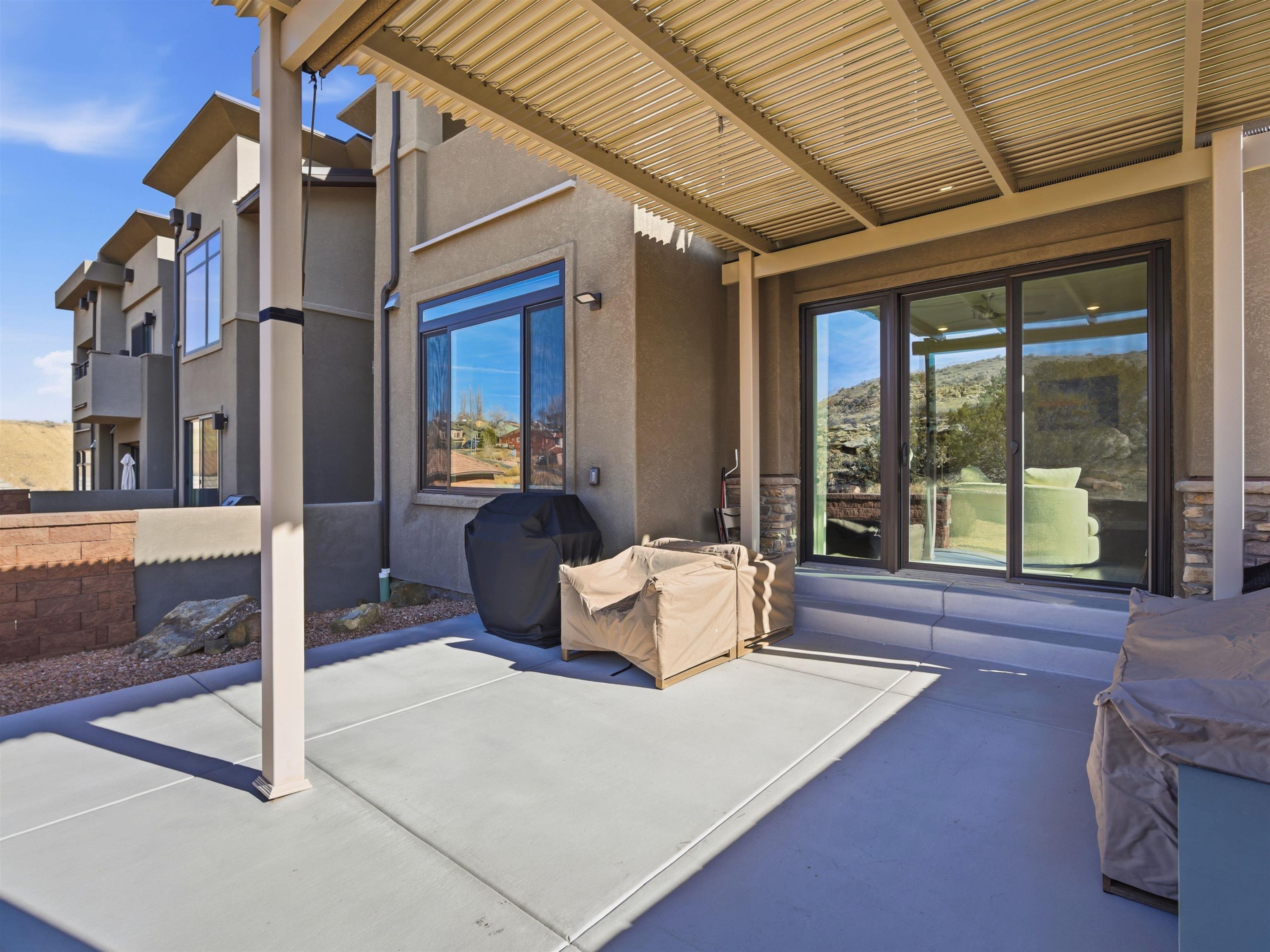 380 West Ridges Boulevard, Unit A Grand Junction, CO 81507 - Photo 31 of 41 a living room with furniture and large windows