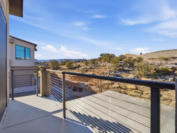 a view of a balcony with an outdoor seating