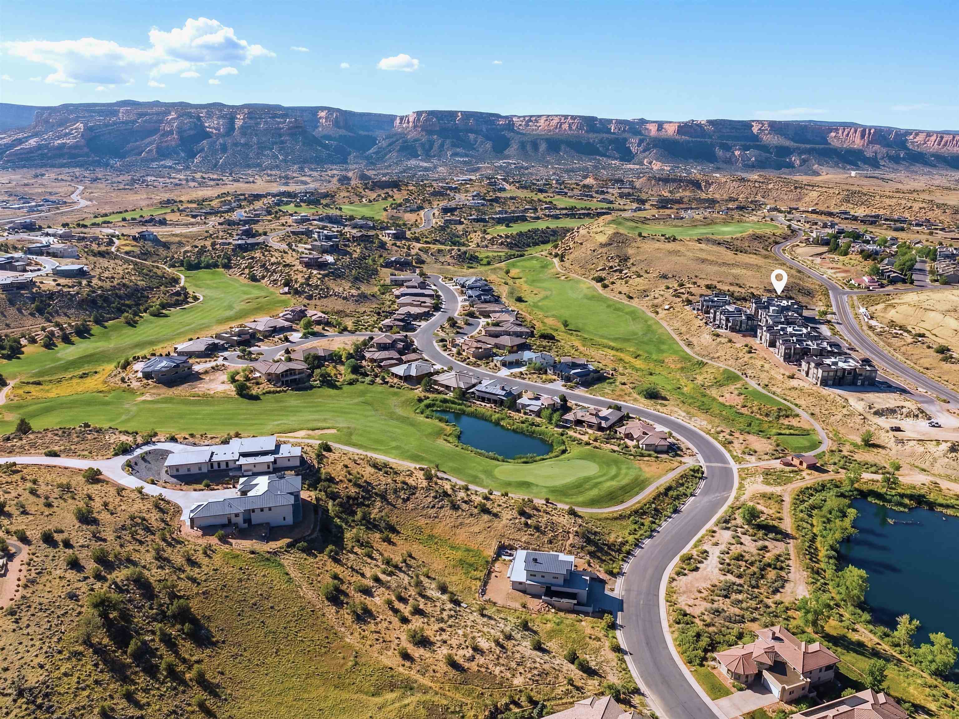 380 West Ridges Boulevard, Unit A Grand Junction, CO 81507 - Photo 40 of 41 an aerial view of a house with a yard and lake view