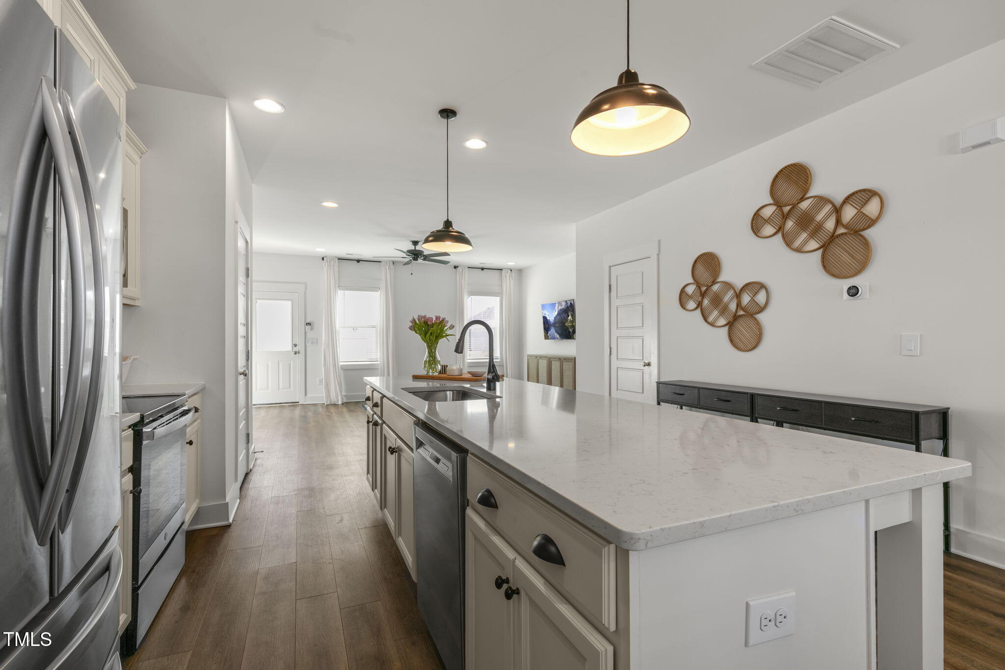 237 Daniel Ridge Road Wendell, NC 27591 - Photo 15 of 41 a kitchen with a sink a counter space and stainless steel appliances