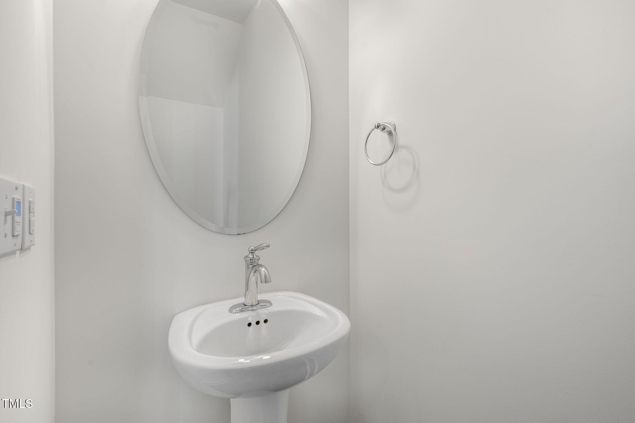 237 Daniel Ridge Road Wendell, NC 27591 - Photo 16 of 41 a bathroom with a sink and a mirror