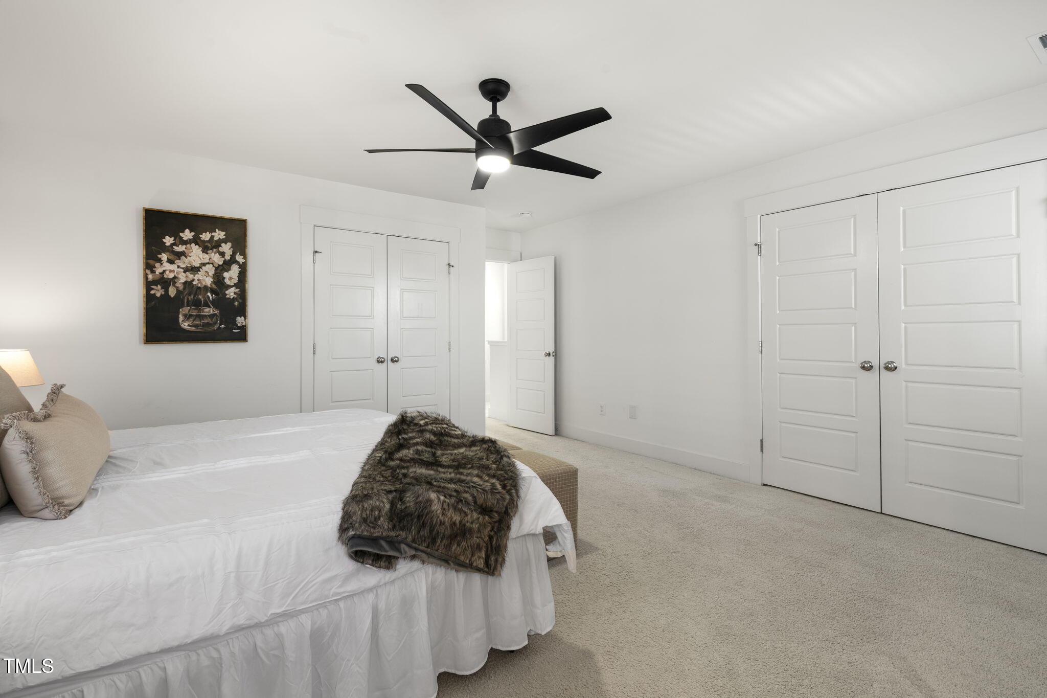 237 Daniel Ridge Road Wendell, NC 27591 - Photo 22 of 41 a bedroom with a bed and a ceiling fan
