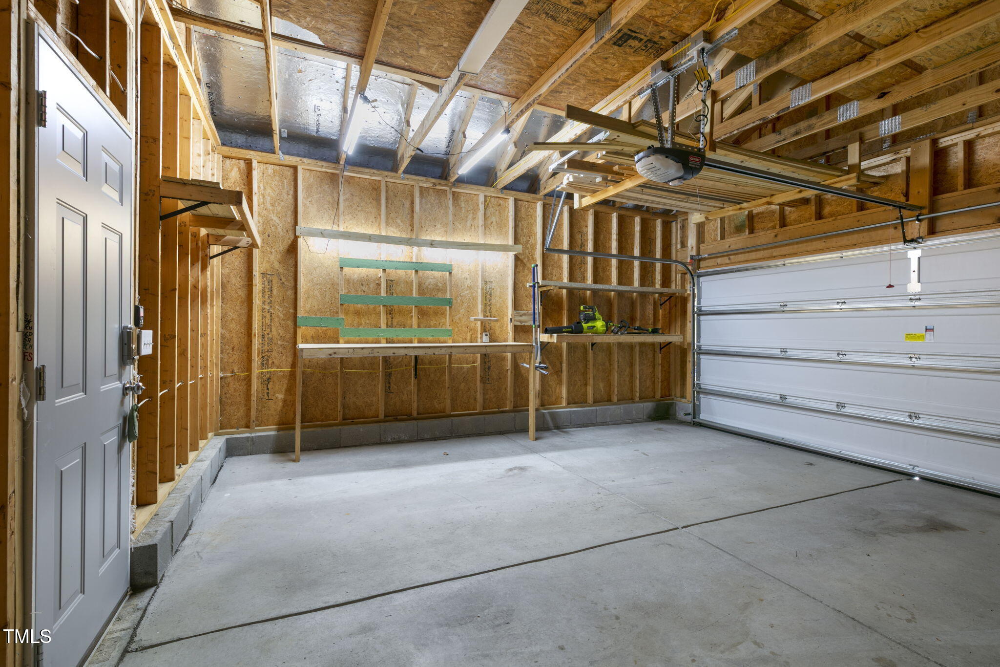 237 Daniel Ridge Road Wendell, NC 27591 - Photo 33 of 41 a view of an empty room with wooden walls