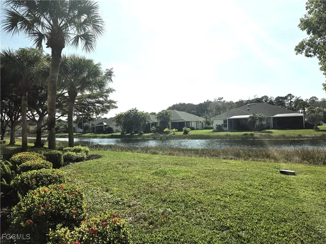 a view of lake with green space