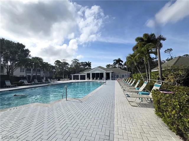 a view of a swimming pool with a patio
