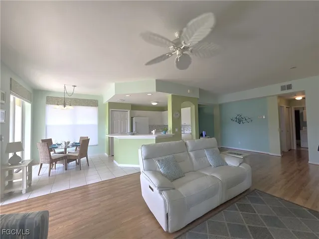 a view of a livingroom with furniture and wooden floor