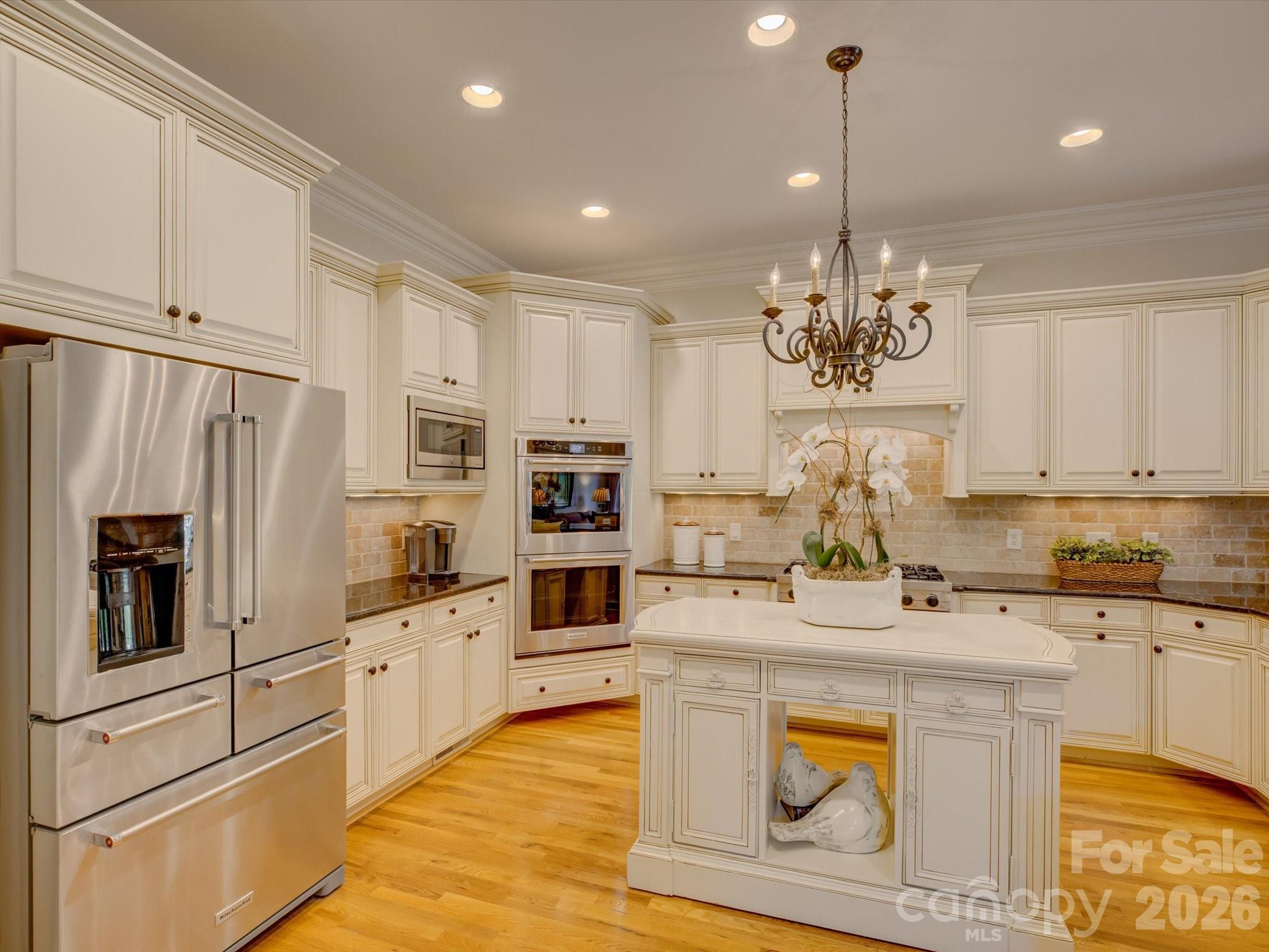 5060 Carmel Road Charlotte, NC 28226 - Photo 13 of 46 a kitchen with stainless steel appliances granite countertop a sink a stove and refrigerator