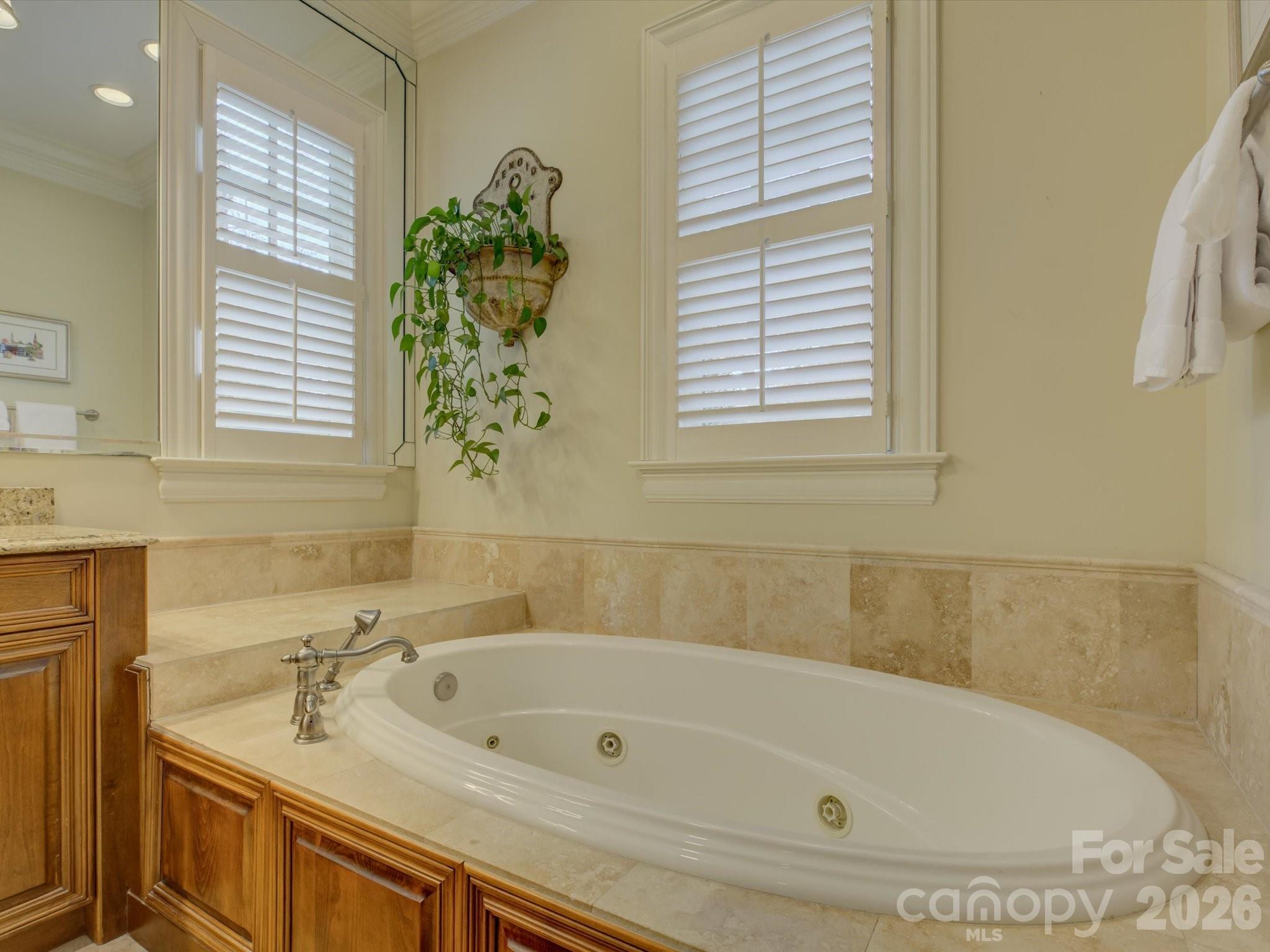 5060 Carmel Road Charlotte, NC 28226 - Photo 25 of 46 a bathroom with a bathtub and a sink