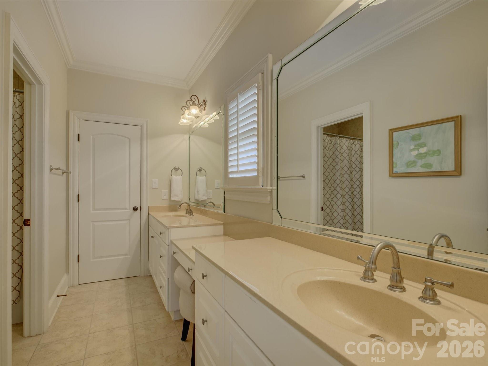 5060 Carmel Road Charlotte, NC 28226 - Photo 30 of 46 a bathroom with a sink double vanity granite tub shower and a mirror