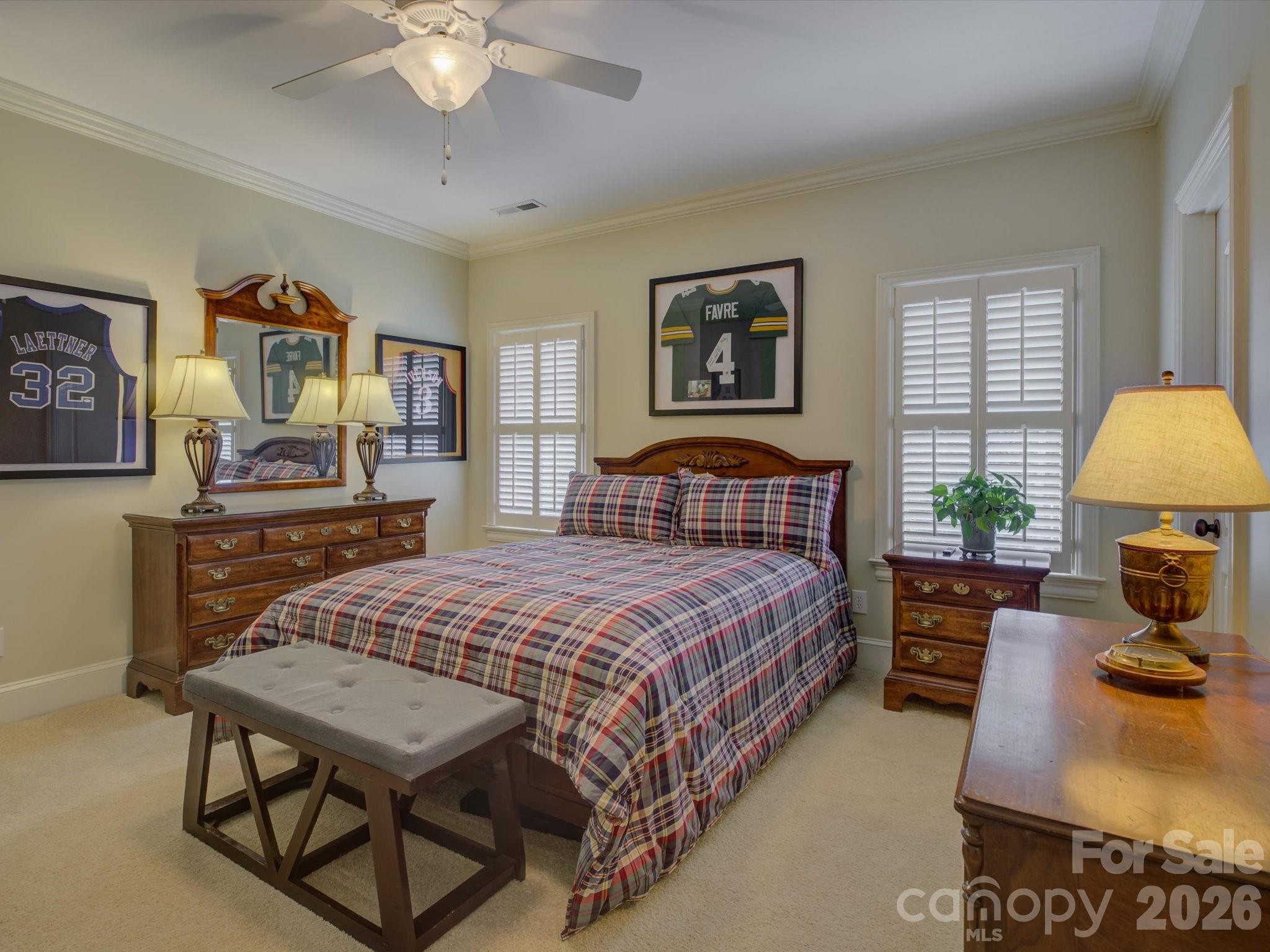 5060 Carmel Road Charlotte, NC 28226 - Photo 31 of 46 a bedroom with a bed a dresser and painting on the wall