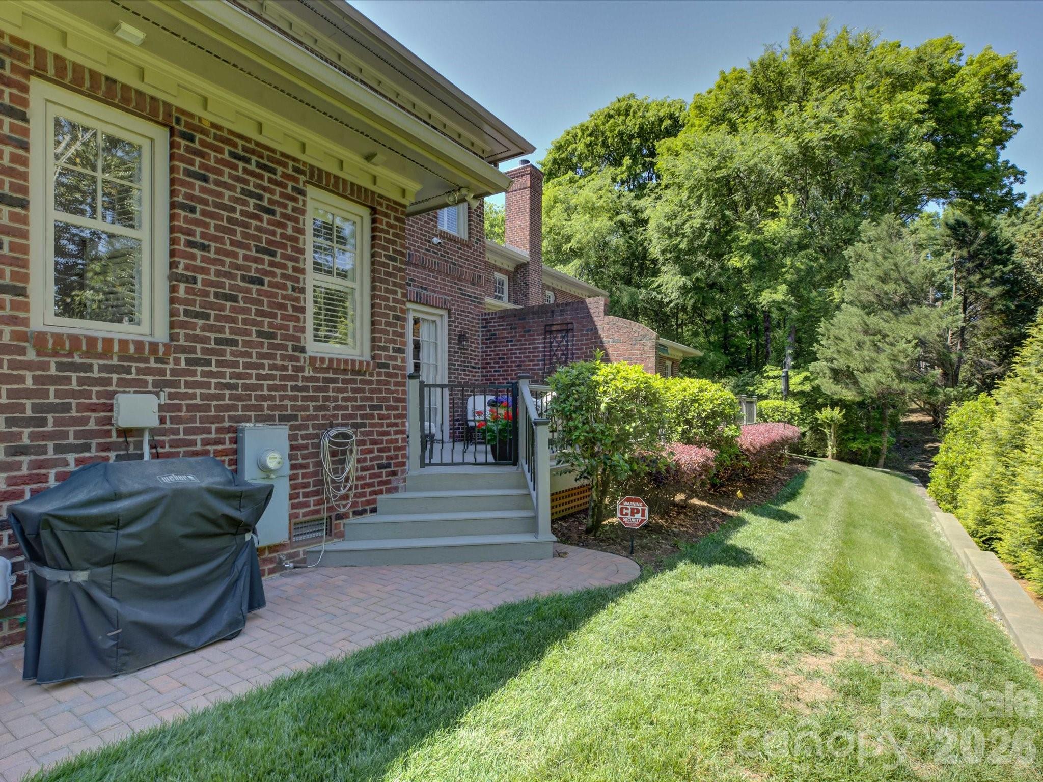 5060 Carmel Road Charlotte, NC 28226 - Photo 38 of 46 a view of a backyard with sitting area and garden