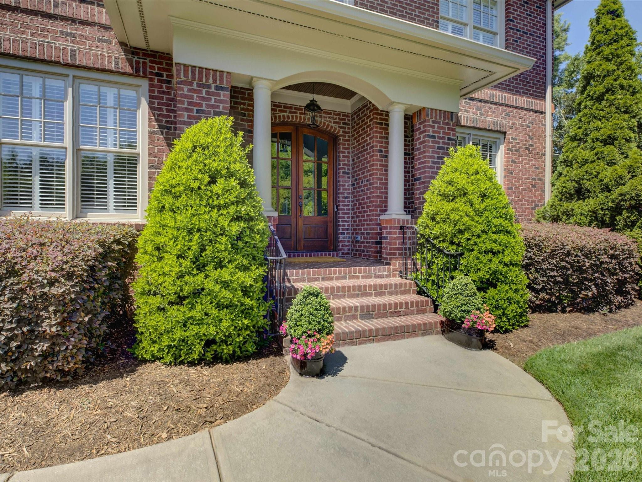 5060 Carmel Road Charlotte, NC 28226 - Photo 4 of 46 a view of a house with potted plants