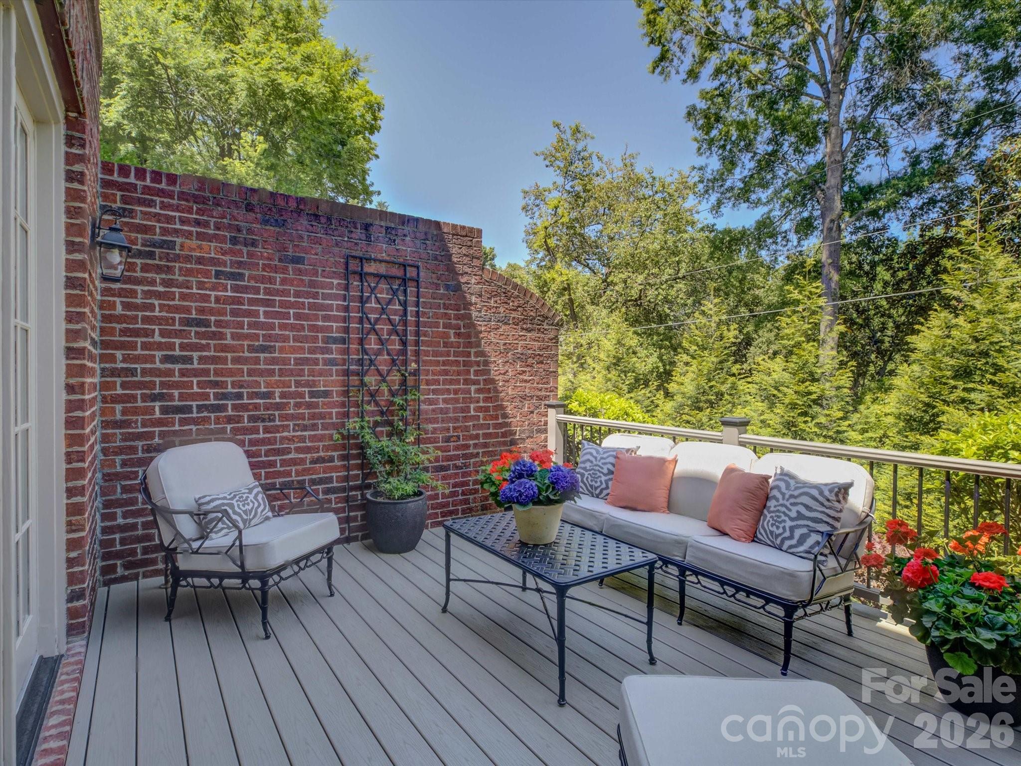 5060 Carmel Road Charlotte, NC 28226 - Photo 41 of 46 a outdoor sitting area with furniture and wooden floor