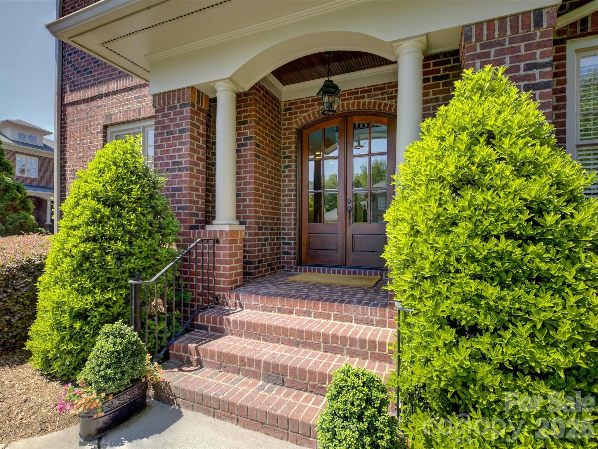 5060 Carmel Road Charlotte, NC 28226 - Photo 5 of 46 a front view of a house with plants