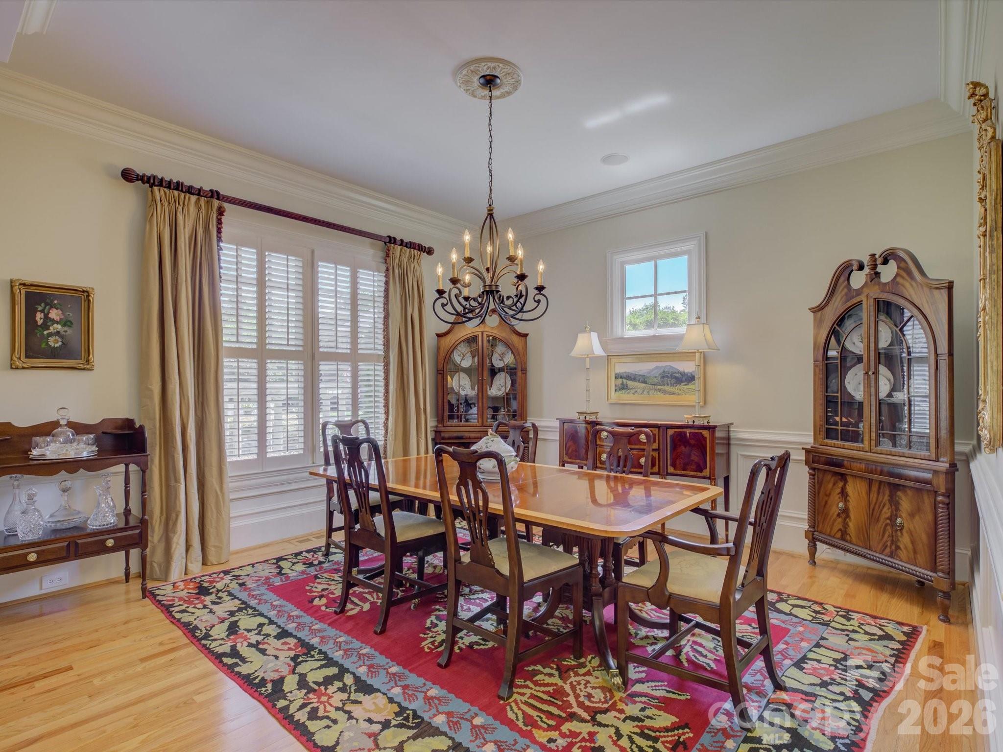 5060 Carmel Road Charlotte, NC 28226 - Photo 8 of 46 a view of a dining room with furniture window and wooden floor