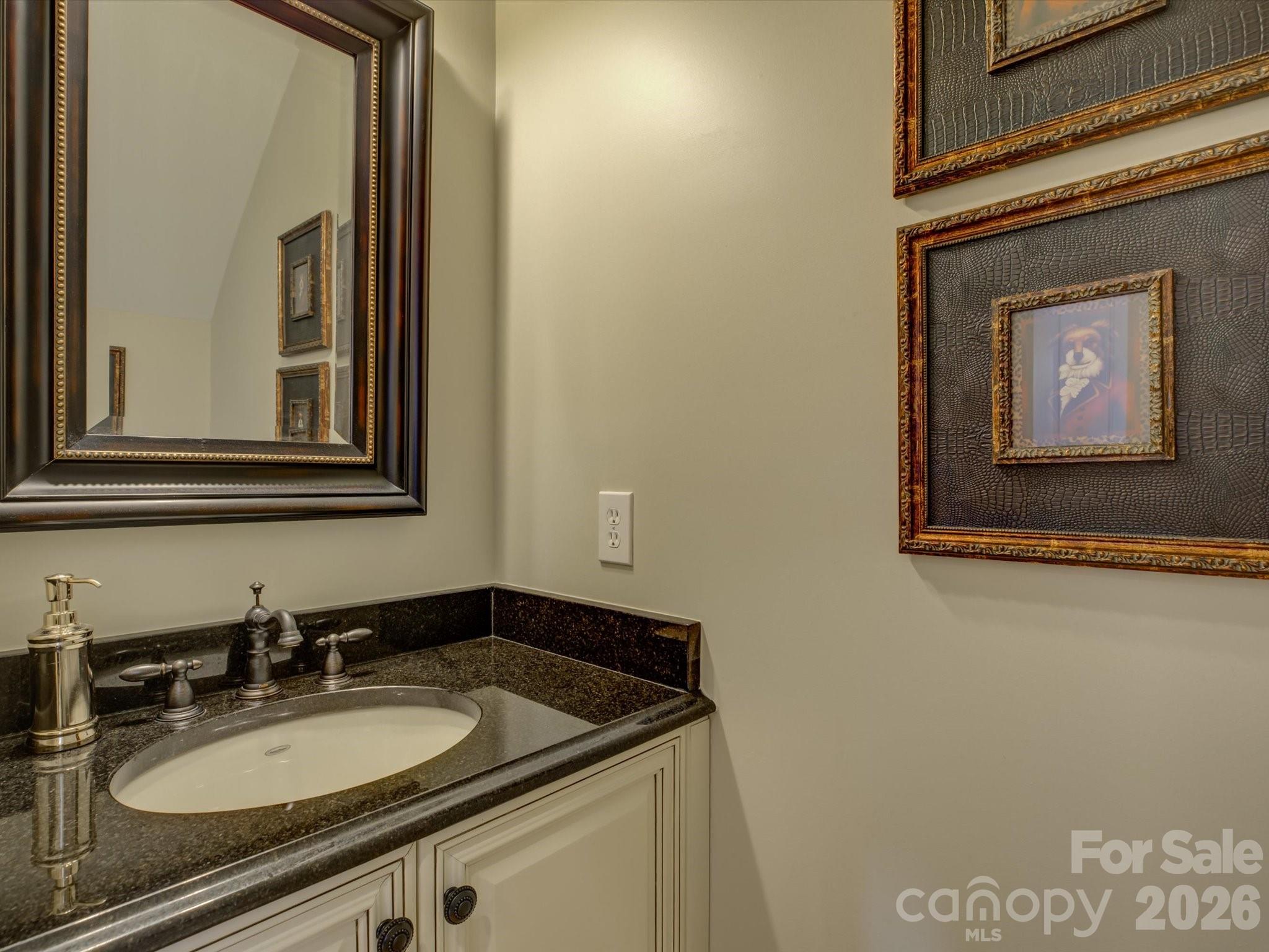 5060 Carmel Road Charlotte, NC 28226 - Photo 10 of 46 a bathroom with a granite countertop sink and a mirror