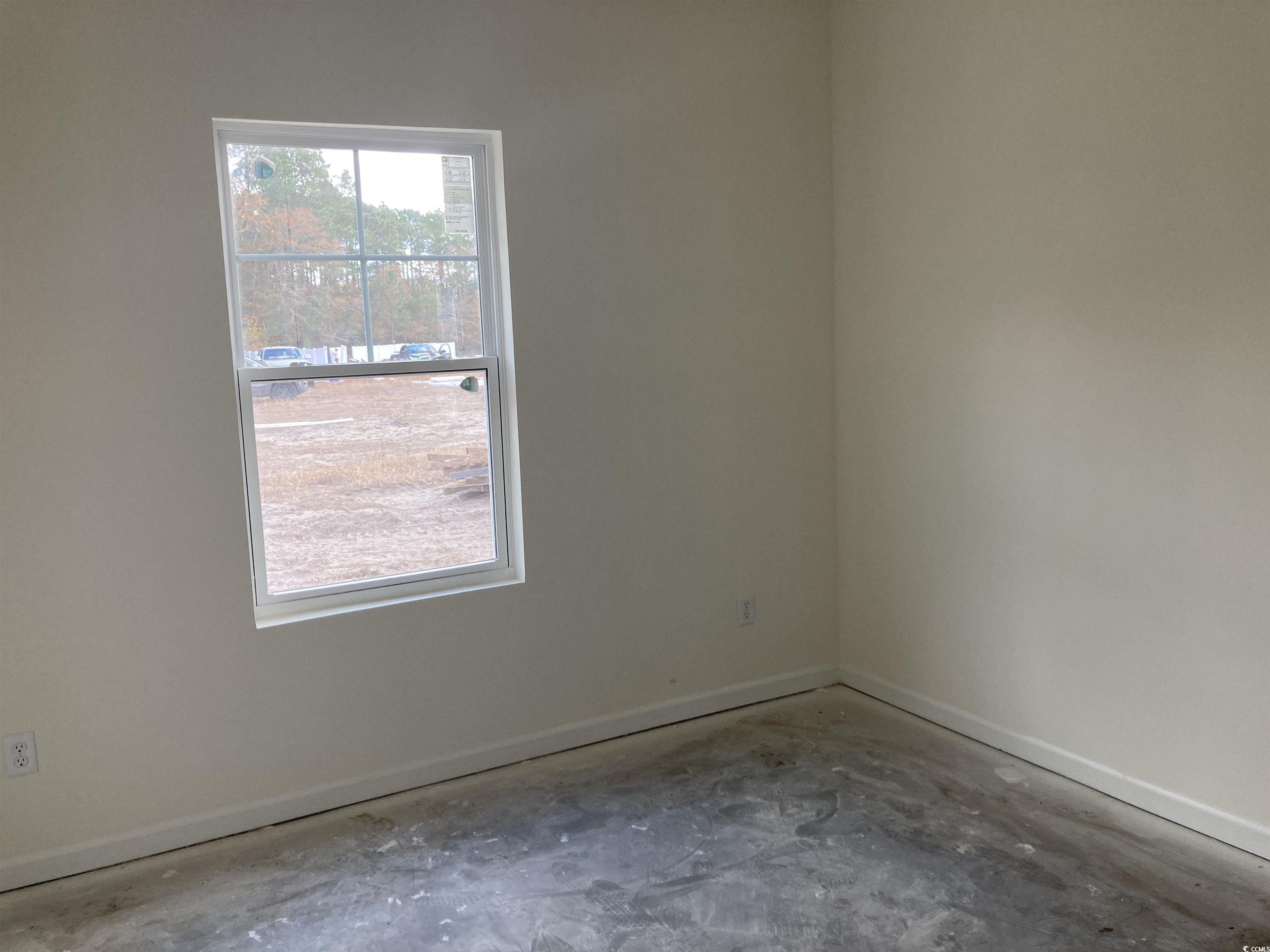 1060 Log Cabin Road Loris, SC 29569 - Photo 19 of 32 Spare room with concrete floors