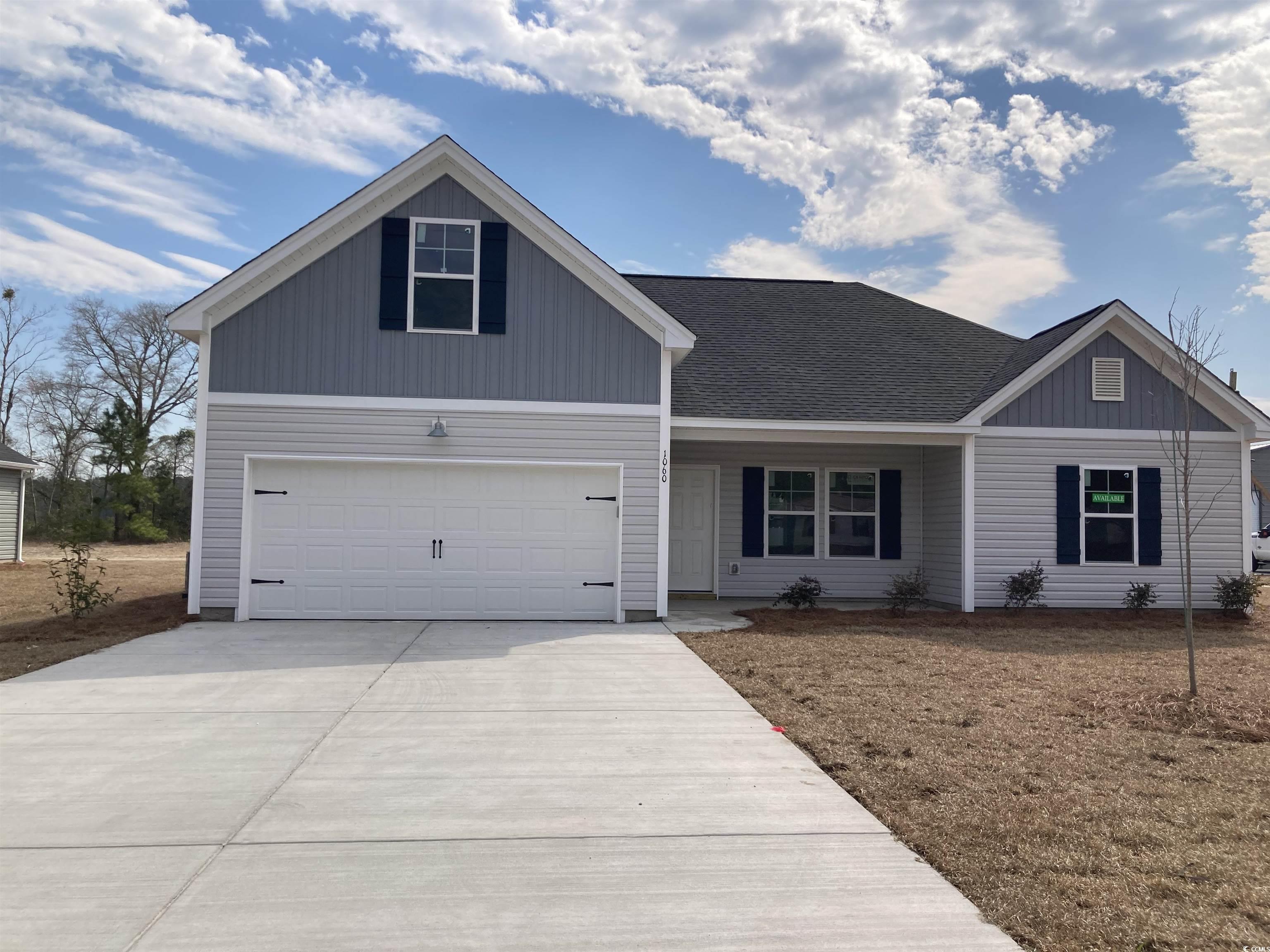 1060 Log Cabin Road Loris, SC 29569 - Photo 3 of 32 View of front of property featuring a garage, driv
