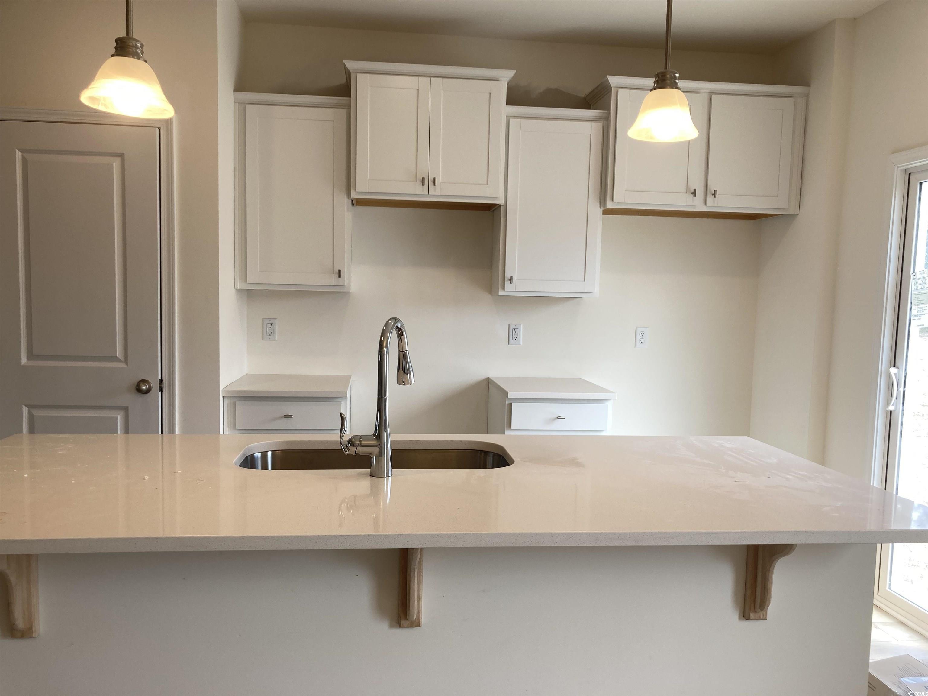 1060 Log Cabin Road Loris, SC 29569 - Photo 4 of 32 Kitchen featuring plenty of natural light, a sink,
