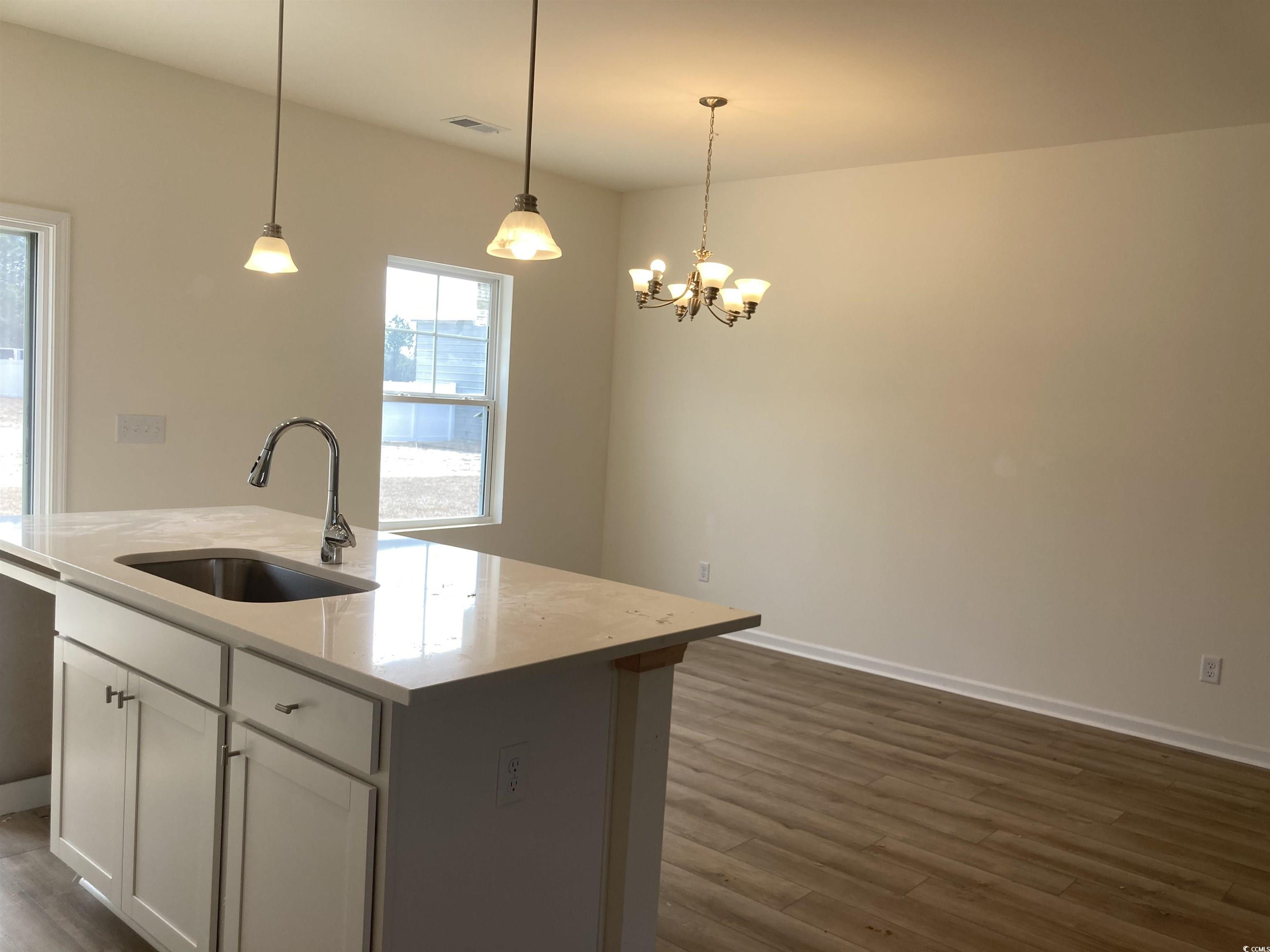 1060 Log Cabin Road Loris, SC 29569 - Photo 5 of 32 Kitchen featuring a sink, baseboards, hanging ligh