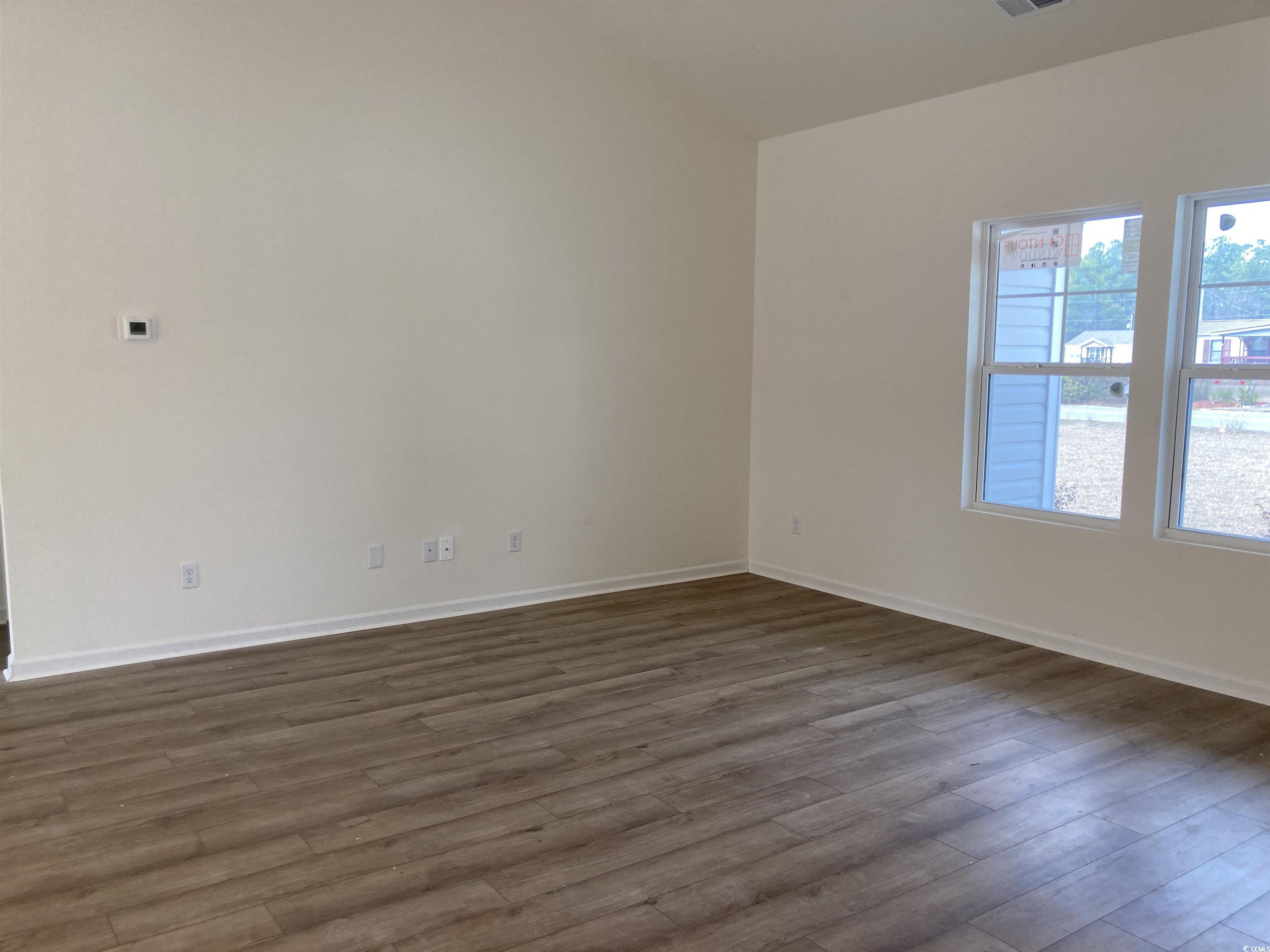 1060 Log Cabin Road Loris, SC 29569 - Photo 6 of 32 Spare room with visible vents, baseboards, and dar
