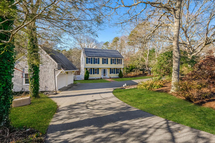 151 Peach Tree Road Marstons Mills, MA 02648 - Photo 1 of 49 a front view of a house with a garden