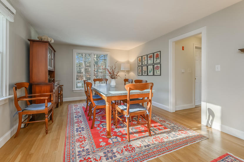 151 Peach Tree Road Marstons Mills, MA 02648 - Photo 15 of 49 a dining room with wooden floor and a table