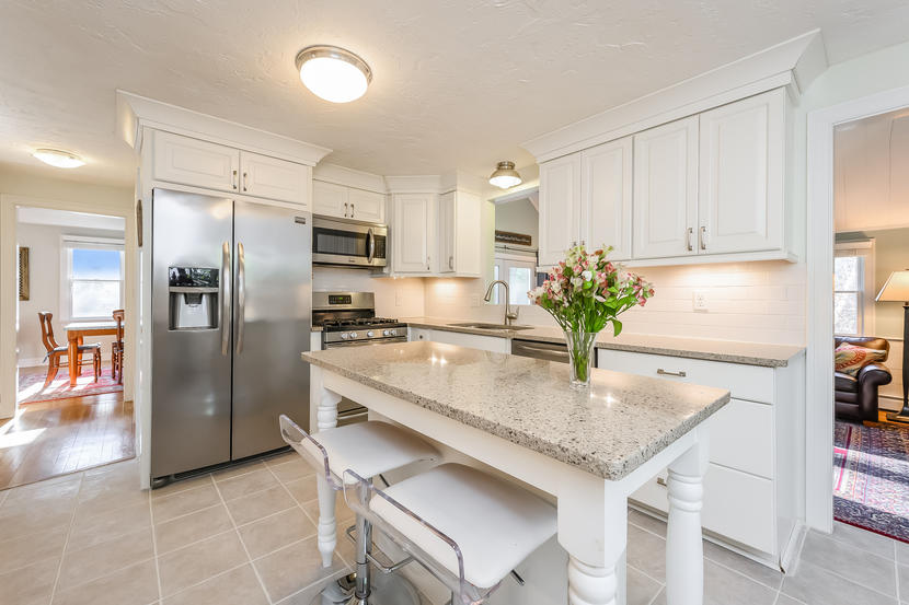 151 Peach Tree Road Marstons Mills, MA 02648 - Photo 21 of 49 a kitchen with stainless steel appliances granite countertop a kitchen island hardwood floor and a refrigerator