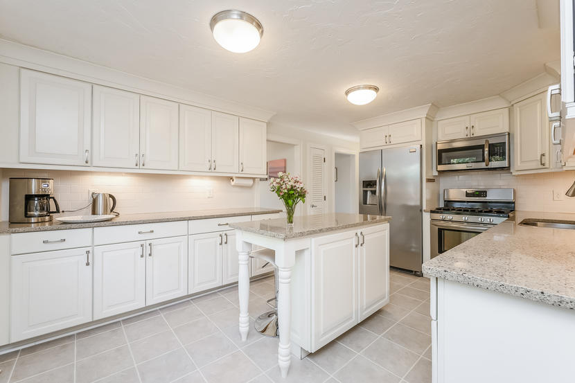 151 Peach Tree Road Marstons Mills, MA 02648 - Photo 22 of 49 a kitchen with granite countertop a sink and white stainless steel appliances