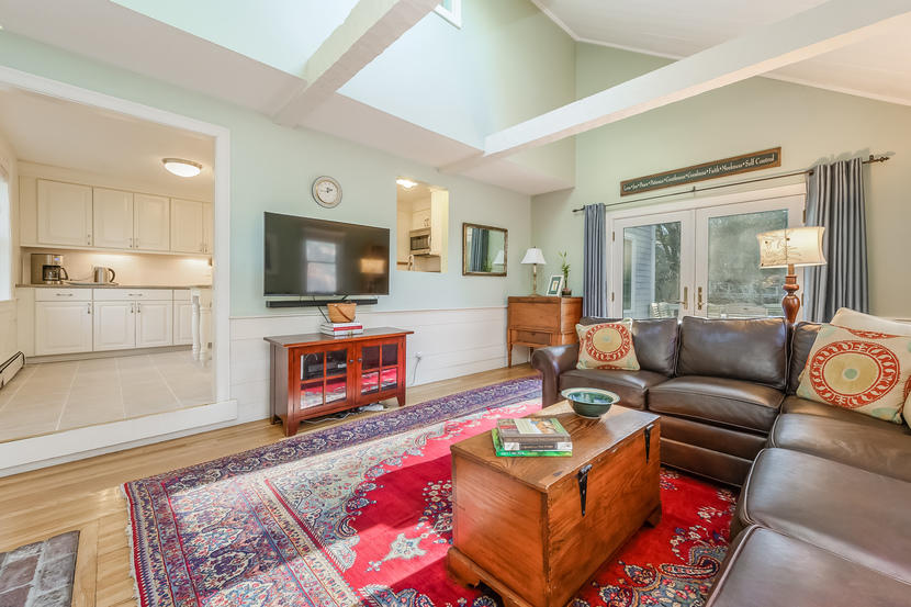 151 Peach Tree Road Marstons Mills, MA 02648 - Photo 25 of 49 a living room with furniture and a flat screen tv