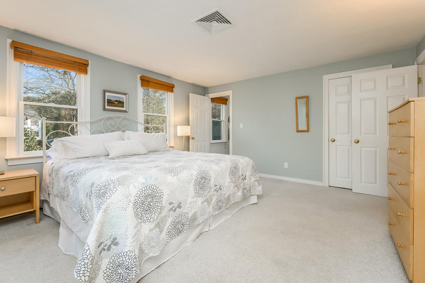 151 Peach Tree Road Marstons Mills, MA 02648 - Photo 28 of 49 a spacious bedroom with a bed and a window