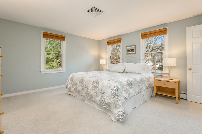151 Peach Tree Road Marstons Mills, MA 02648 - Photo 29 of 49 a bedroom with a bed painting on wall and two windows