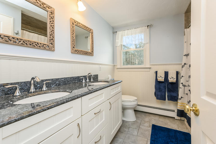 151 Peach Tree Road Marstons Mills, MA 02648 - Photo 37 of 49 a bathroom with a granite countertop toilet sink and mirror