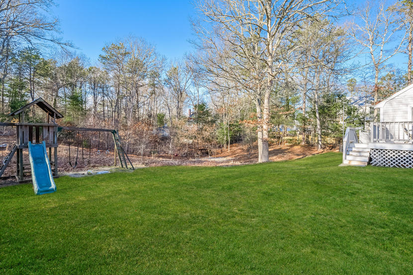 151 Peach Tree Road Marstons Mills, MA 02648 - Photo 7 of 49 a view of a garden with a slide
