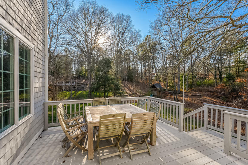 151 Peach Tree Road Marstons Mills, MA 02648 - Photo 8 of 49 a view of a chairs and table on the deck