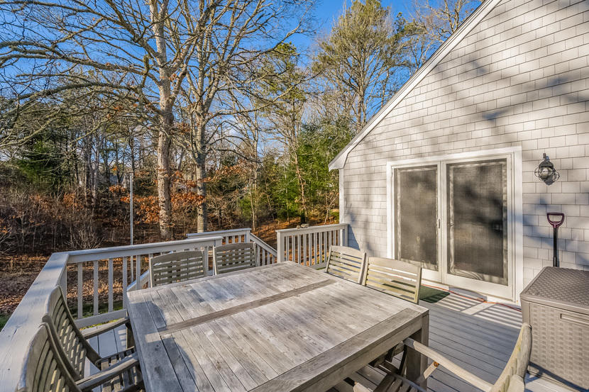 151 Peach Tree Road Marstons Mills, MA 02648 - Photo 9 of 49 a view of backyard with deck and outdoor seating