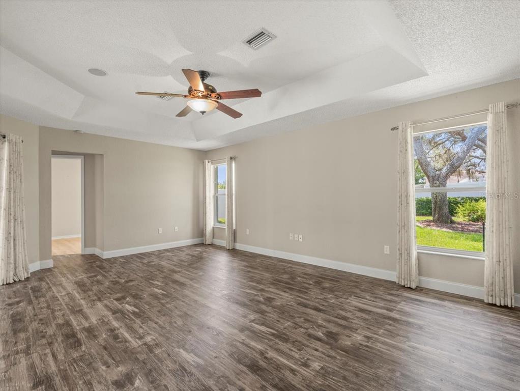 14717 Linden Drive Spring Hill, FL 34609 - Photo 11 of 29 a view of an empty room with window and a kitchen